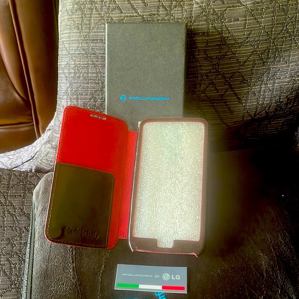 New leather cell phone holder. Brown leather exterior, rich red suede interior.